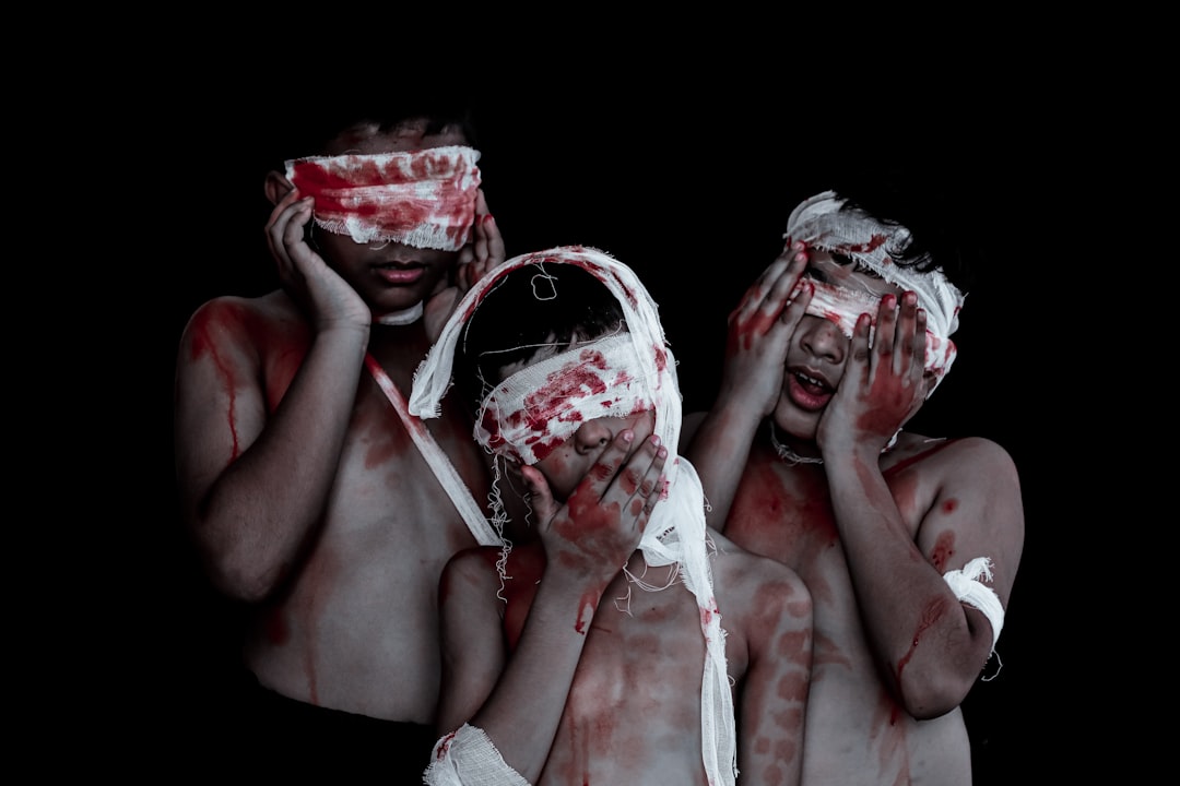 a couple of people that are covered in blood
