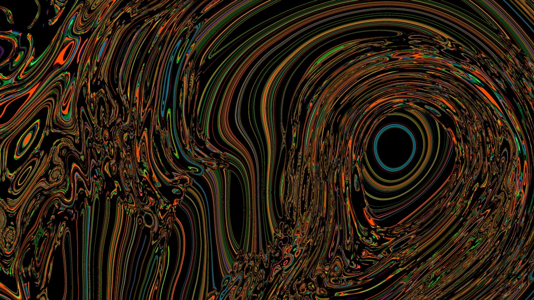 Colorful, swirling abstract art with a black void.